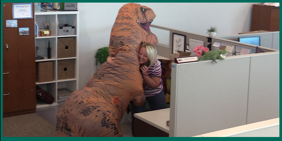 Dinosaur gives Hugs at Christian Brothers Automotive Dinosaur gives Hugs at Christian Brothers Automotive